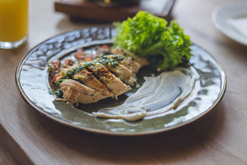 Steak with salad, sauce and glass of fresh juice