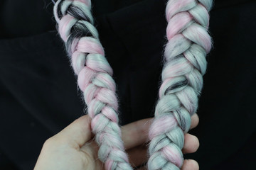 pink braids with kanekalon close-up hairstyles, thick braid and a neutral background