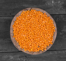 Red Lentils or Masoor Dal on Wooden Background