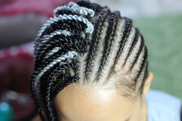 process of attaching Senegal braids to dreadlocks, African hairstyles, spirals, pigtails