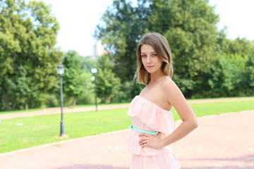 Naklejka premium Young beautiful blonde woman in pink dress