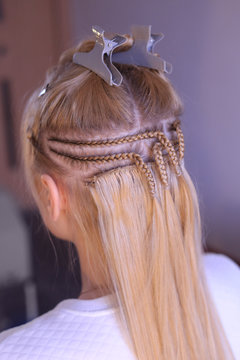 escalating with the help of sewing to the pigtail, the process of work, Hollywood hair extension on the track