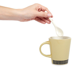 Porcalain brown tea cup with hand isolated on white background