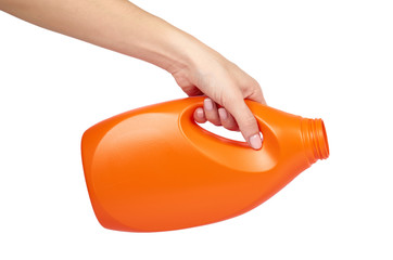 Orange plastic detergent bottle with hand isolated on white background