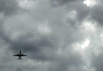 airplane in storm clouds