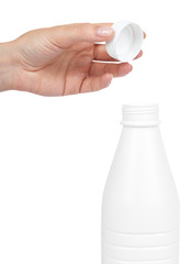 White plastic milk bottle with hand isolated on white background