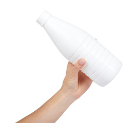 White plastic milk bottle with hand isolated on white background