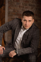 Obraz premium Serious Caucasian man with short black hair in business formal outfit.