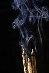 Make smoke from incense.  Black background