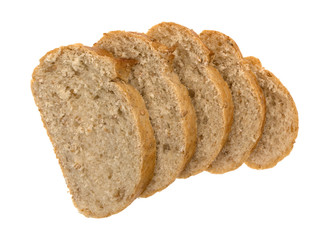 Top view of several slices of whole wheat bread loaf isolated on a white background.