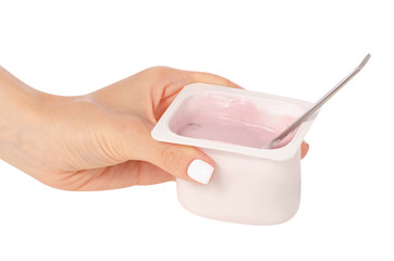 Yogurt with a spoon in hand on a white background isolation