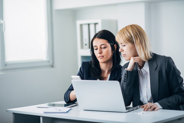 Colleagues working in office