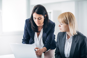 Colleagues working in office