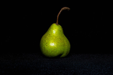 Fresh pears on a dark background. Selective focus