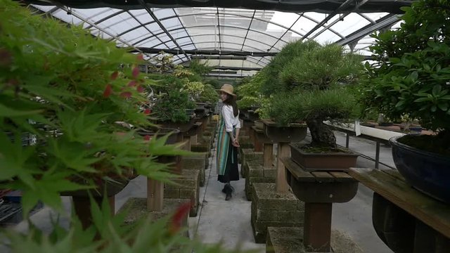 Beautiful asian girl working in the japanese greenhouse
