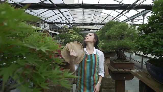 Beautiful asian girl working in the japanese greenhouse
