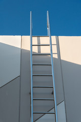 metal ladder on rooftop of building for maintenance