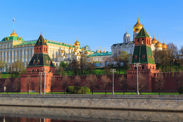 Towers of Moscow Kremlin on a Kremlevskaya embankment background