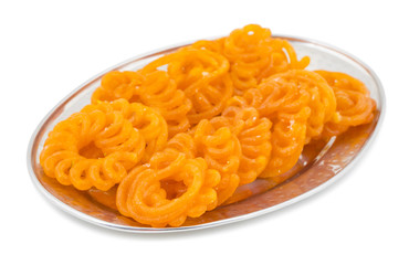 Indian Sweet Food Imarti Also Know as Amriti, Omriti, Jahangir, Jalebi, Jaangiri. It is Mde by Deep-Frying Vigna Mungo Flour Batter in a Kind of Circular Flower Shape. isolated on white Background