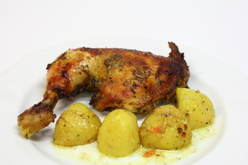 grilled chicken and potatoes on the plate