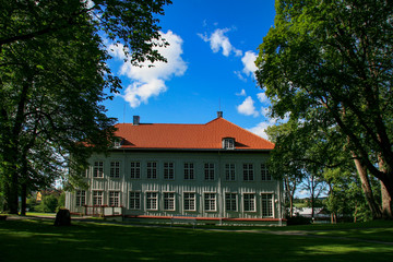 Fototapeta na wymiar Histiric building on Eidsvold Norway - In this building at Eidsvold, Norway's constitution was signed May 17 1814