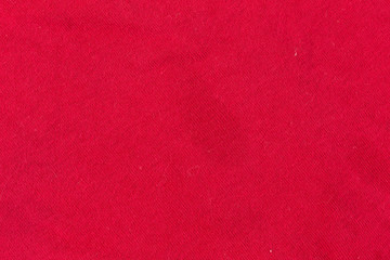 Stains on a bright red shirt.