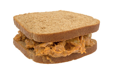 Curry flavored tuna sandwich isolated on a white background.