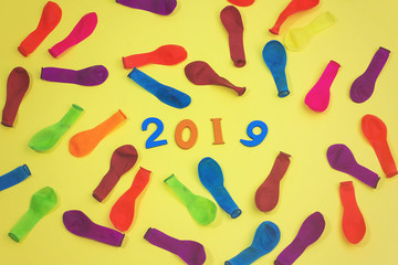 colorful wooden numbers forming the number 2019 with ballons , For the new year 2019