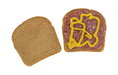 Top view of an uncured soppressata dry salami sandwich isolated on a white background. 