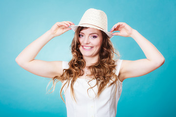 Charming woman in summer straw hat