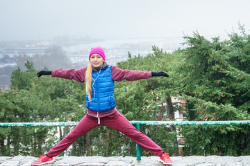 Woman exercising outside during autumn