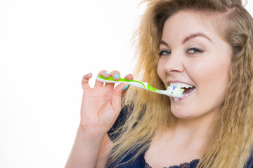 Woman brushing cleaning teeth