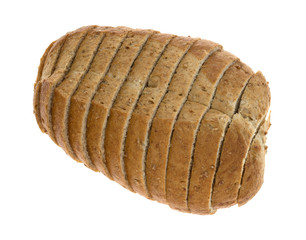 Top view of a small loaf of sliced wheat bread isolated on a white background.