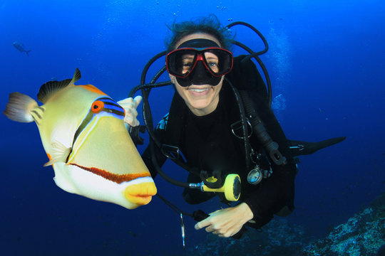 Scuba diving in ocean with fish