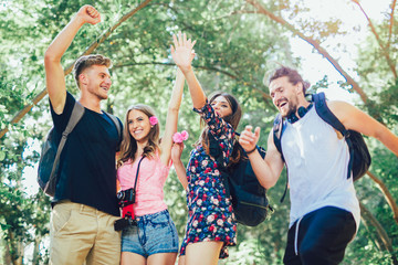 Group of young people having fun in summer park