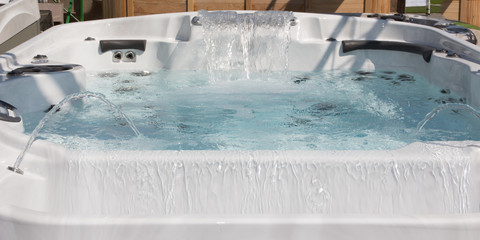 garden home spa detail isolated and falling water jet