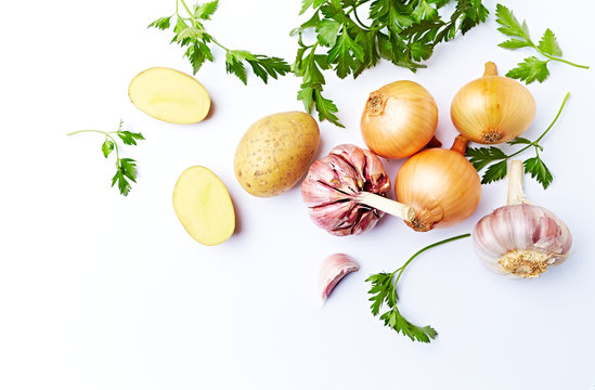 Fresh Vegetables for a healthy Meal (potatoes, onion, garlic, parsley) ; symbolic image