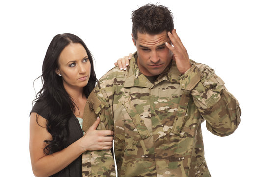 Wife comforting her military husband