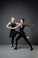 Fototapeta na wymiar Pretty graceful couple of dancers training and dancing together.