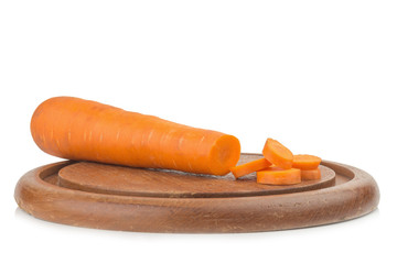 carrot sliced on wood chopping Board isolated on white background