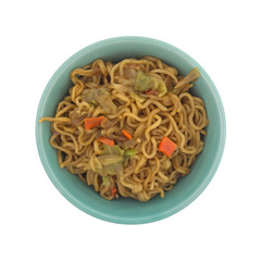 Top view of beef flavored ramen noodles in a bowl isolated on a white background.