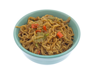 Beef flavored ramen noodles in a bowl isolated on a white background.