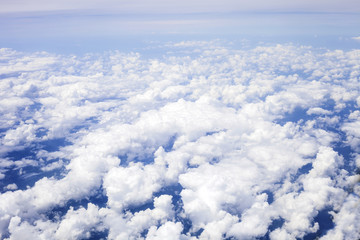 White fluffy clouds in blue sky, top view