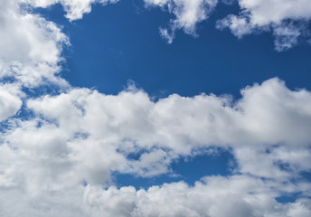 Naklejka na ściany i meble Blue sky and white clouds. Nature cloud landscape. Clouds in the blue sky. Blue sky background
