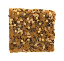 Whole wheat flax and sesame seed cracker isolated on a white background.
