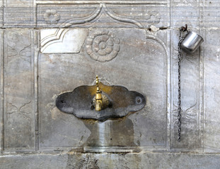 Turkish ottoman style faucet. Ablution fountain in the courtyard of a old mosque in Istanbul