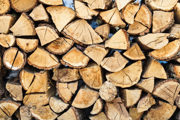 Fototapeta premium A pile of firewood. Wood texture background