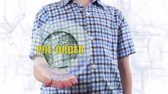 Young man shows a hologram of the planet Earth and text Pre order. Boy with future technology 3d projection on a modern white digital background