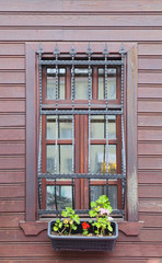 potted wooden house window