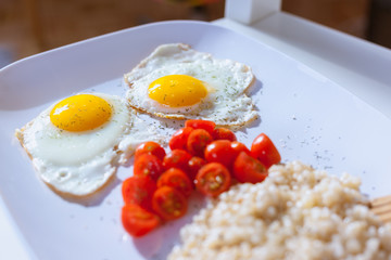 Eggs, tomatoes and couscous for breakfast
